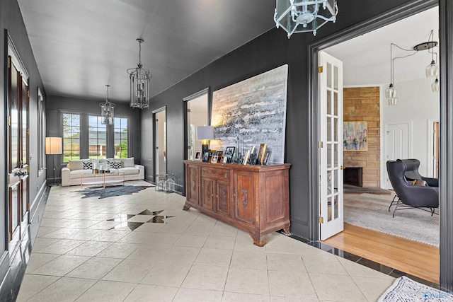 702 5th Ave SE, Cullman, AL 35055 - interior space with a chandelier, french doors, baseboards, and tile patterned flooring