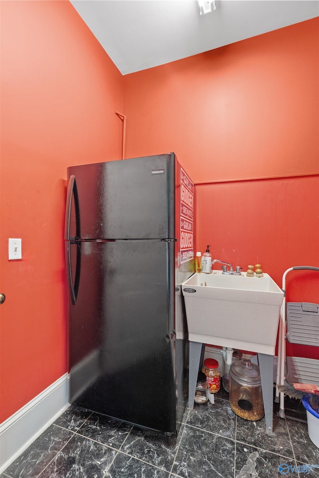 702 5th Ave SE, Cullman, AL 35055 - kitchen featuring marble finish floor, freestanding refrigerator, and baseboards