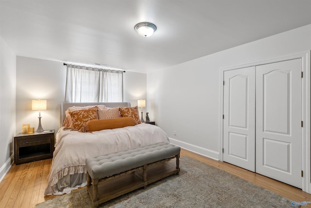 702 5th Ave SE, Cullman, AL 35055 - bedroom with light wood-style flooring, a closet, and baseboards