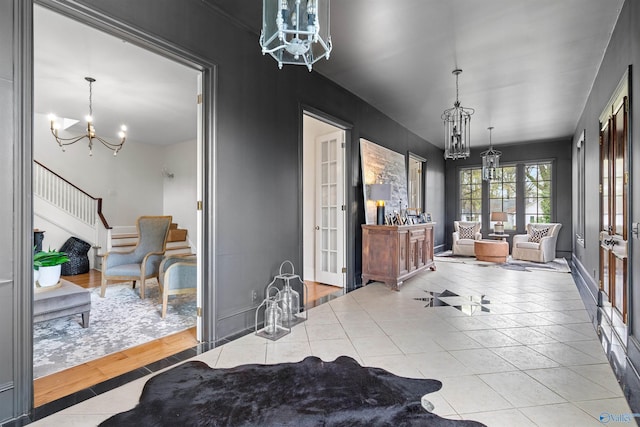 702 5th Ave SE, Cullman, AL 35055 - dining area with stairway, tile patterned floors, french doors, a notable chandelier, and baseboards