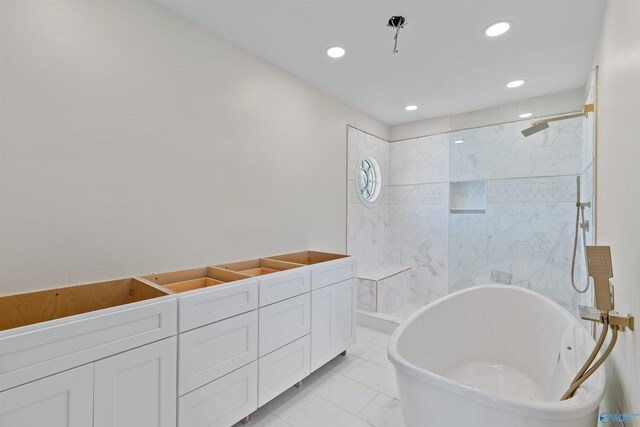 702 5th Ave SE, Cullman, AL 35055 - bathroom with walk in shower, recessed lighting, and a soaking tub