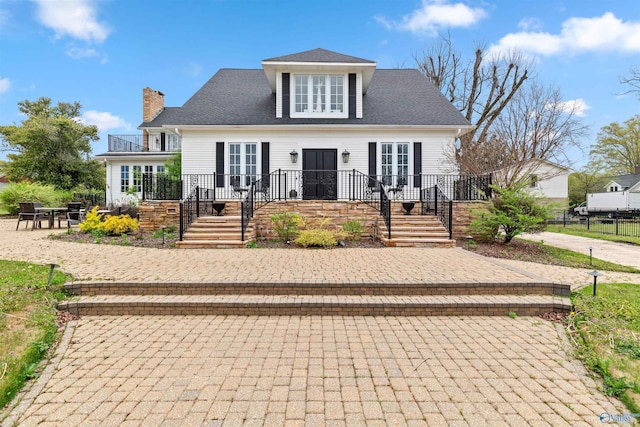 702 5th Ave SE, Cullman, AL 35055 - bungalow-style house featuring a chimney, a shingled roof, a patio, and stairs