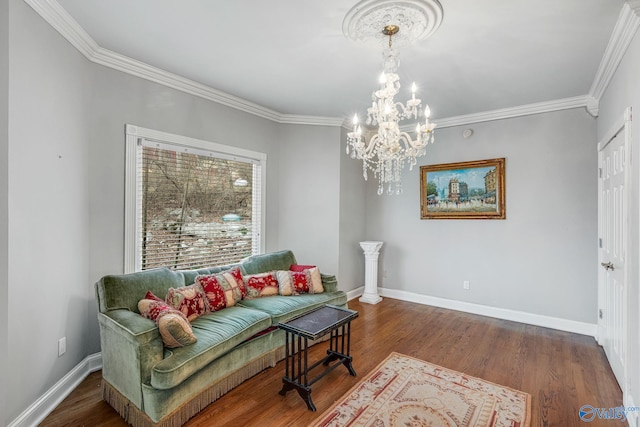 living area with crown molding, a notable chandelier, and dark hardwood / wood-style flooring