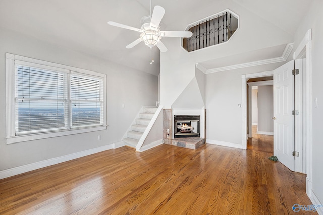 unfurnished living room with crown molding, ceiling fan, and hardwood / wood-style floors