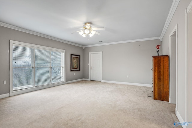 unfurnished room featuring light carpet, ornamental molding, and ceiling fan