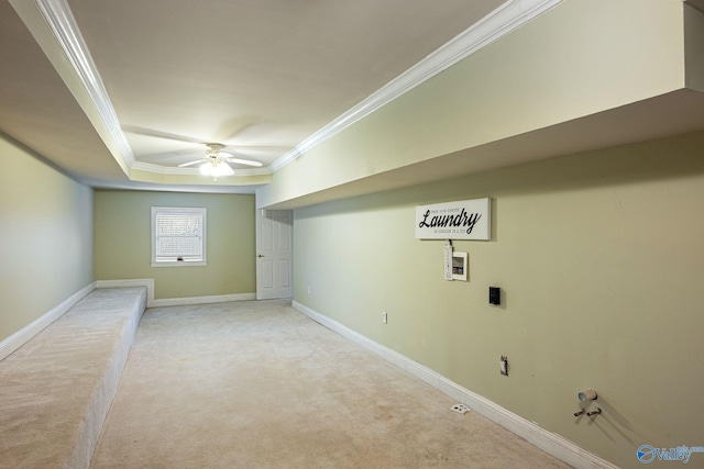 basement with light carpet, crown molding, and ceiling fan