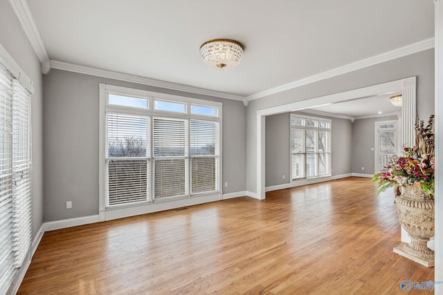 unfurnished room featuring crown molding and light hardwood / wood-style flooring