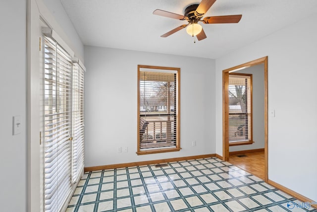 unfurnished room featuring ceiling fan