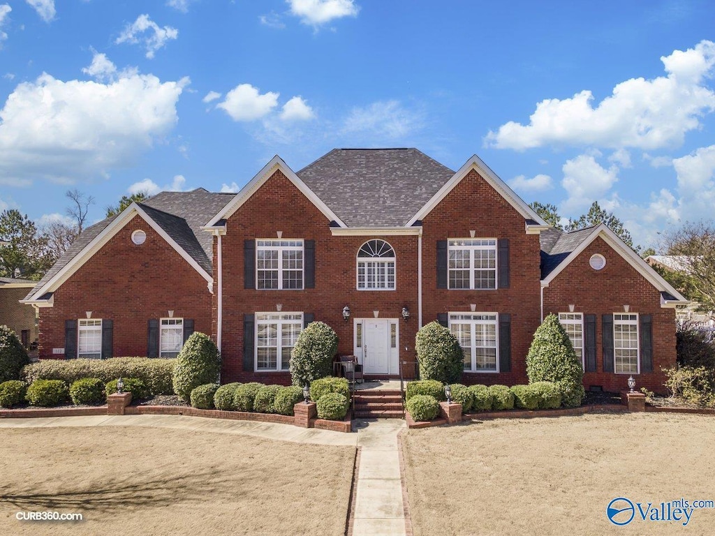 colonial house with brick siding