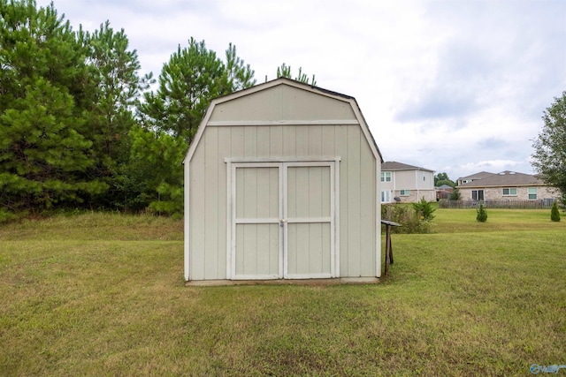 view of outdoor structure featuring a lawn