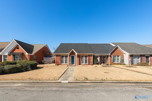 view of front of home with brick siding