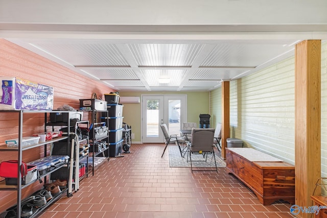 interior space featuring french doors and a wall mounted air conditioner