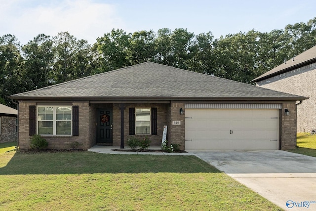 ranch-style home featuring a garage and a front lawn