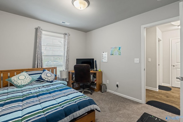 bedroom featuring light hardwood / wood-style floors