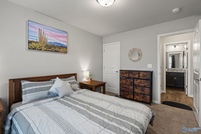 bedroom with carpet and ensuite bath