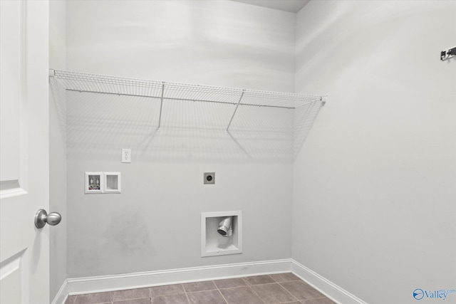 clothes washing area with tile patterned flooring, hookup for a washing machine, and electric dryer hookup