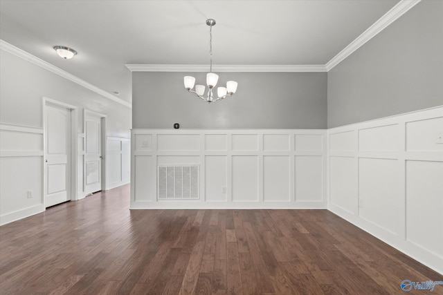 unfurnished dining area with crown molding, dark hardwood / wood-style flooring, and a notable chandelier