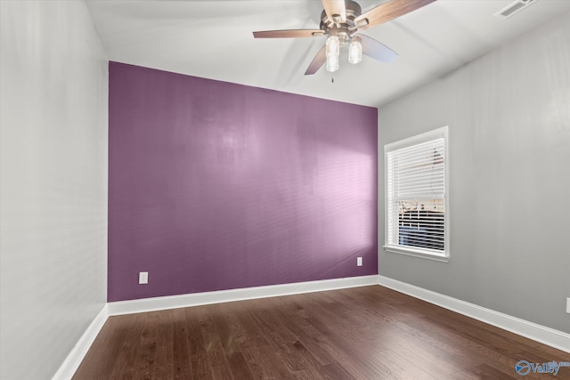 unfurnished room with hardwood / wood-style flooring and ceiling fan