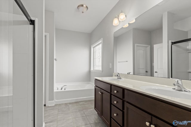 bathroom with vanity, separate shower and tub, and tile patterned floors