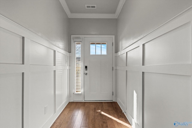 entrance foyer featuring crown molding and hardwood / wood-style flooring