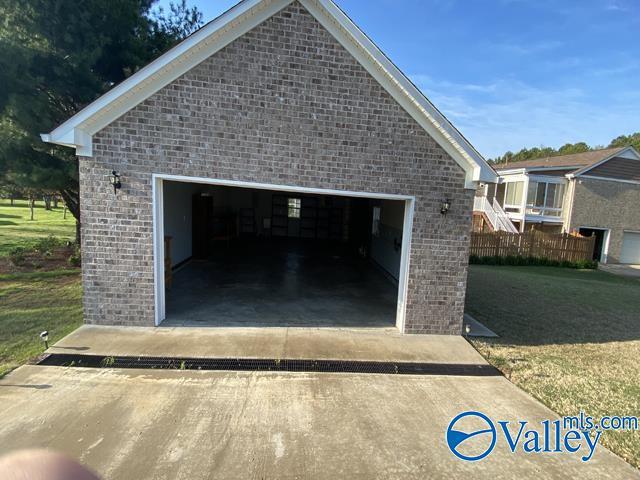 garage with a yard