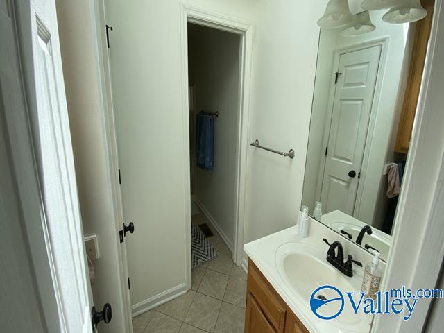 bathroom featuring tile patterned floors and vanity