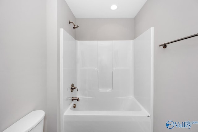 bathroom with toilet and shower / bathing tub combination