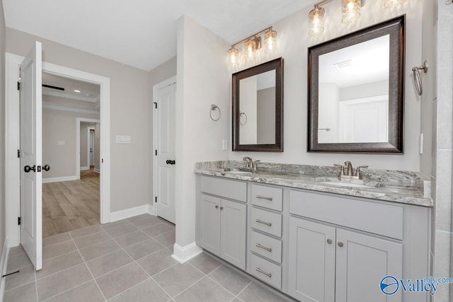 bathroom with vanity and tile patterned flooring