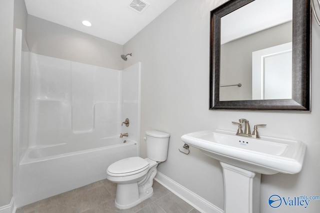 full bathroom with bathtub / shower combination, sink, toilet, and tile patterned flooring