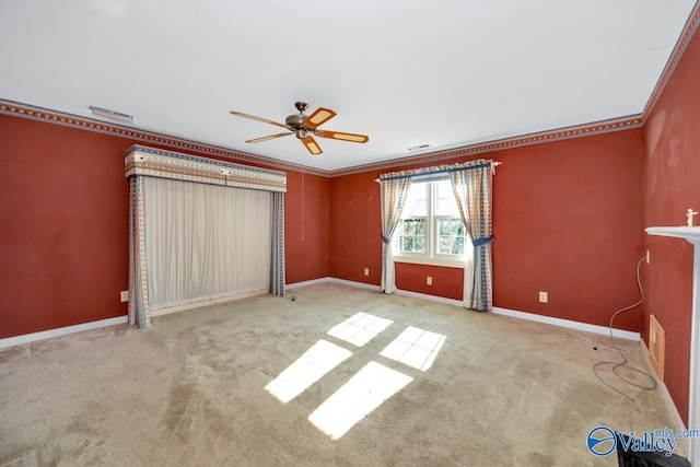 unfurnished bedroom with crown molding, ceiling fan, and light colored carpet