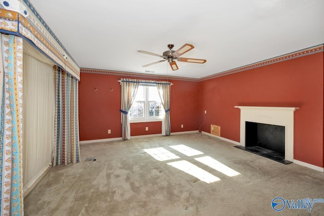 unfurnished living room with ceiling fan, light colored carpet, and ornamental molding