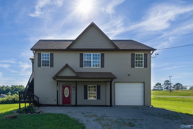 front of property with a garage and a front yard