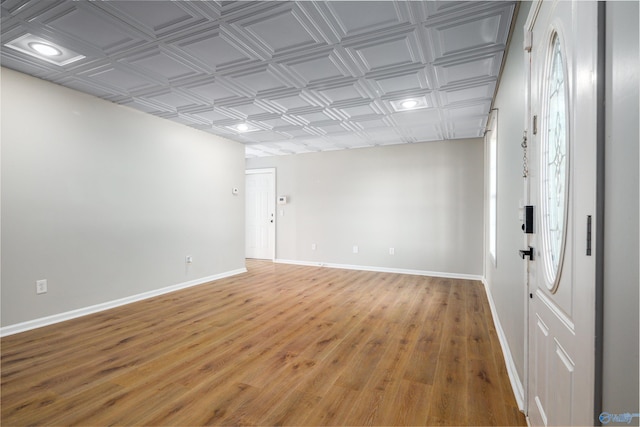 spare room featuring wood-type flooring