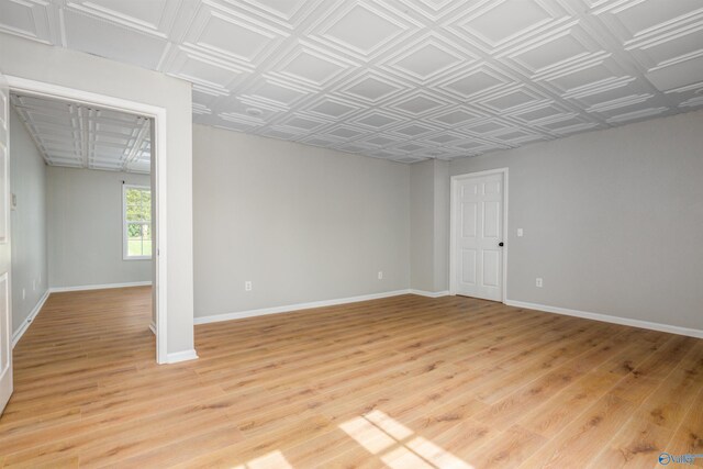 empty room with light hardwood / wood-style floors