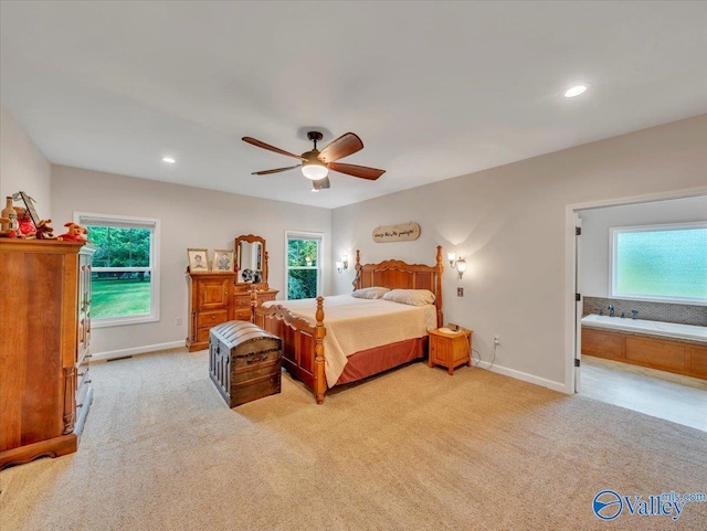 591 Nix Rd, Hazel Green, AL 35750 - bedroom with light carpet, baseboards, recessed lighting, ceiling fan, and ensuite bath