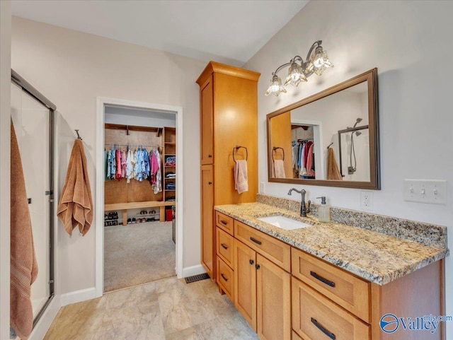 591 Nix Rd, Hazel Green, AL 35750 - bathroom with a spacious closet, a stall shower, and vanity