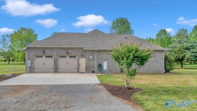 591 Nix Rd, Hazel Green, AL 35750 - view of side of home featuring driveway, a garage, a lawn, and brick siding