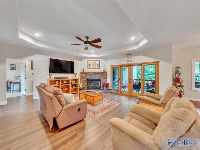 591 Nix Rd, Hazel Green, AL 35750 - living room featuring a raised ceiling, wood finished floors, a ceiling fan, baseboards, and recessed lighting