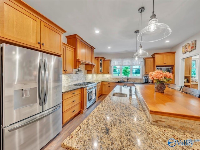 591 Nix Rd, Hazel Green, AL 35750 - kitchen featuring stainless steel appliances, plenty of natural light, a sink, decorative backsplash, and recessed lighting
