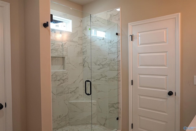 full bath featuring a marble finish shower