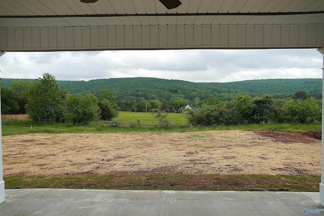 property view of mountains with a wooded view