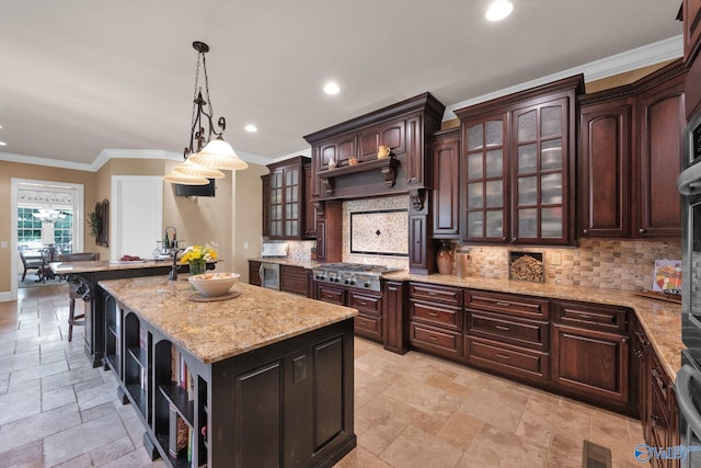 201 Atwater Dr, Madison, AL 35756 - kitchen featuring stone tile floors, a center island, decorative backsplash, stainless steel gas stovetop, and recessed lighting