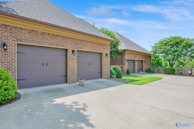 201 Atwater Dr, Madison, AL 35756 - view of front of property featuring brick siding, roof with shingles, a garage, and concrete driveway