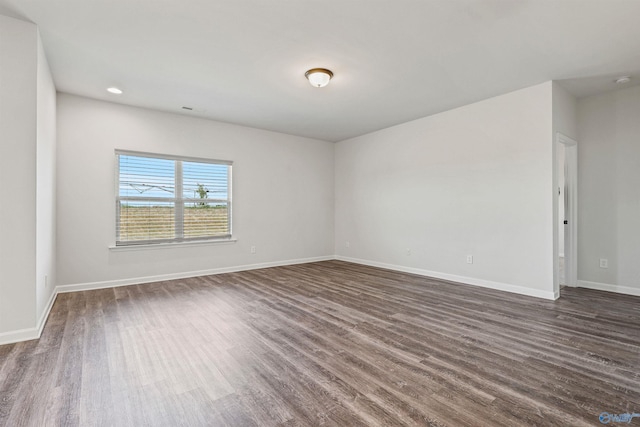 empty room featuring dark hardwood / wood-style floors