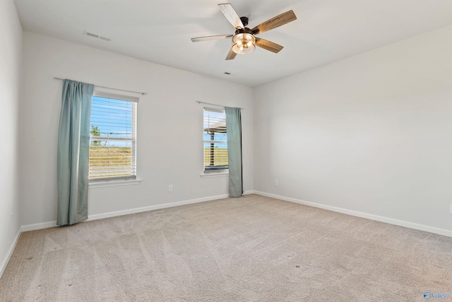 carpeted empty room with ceiling fan