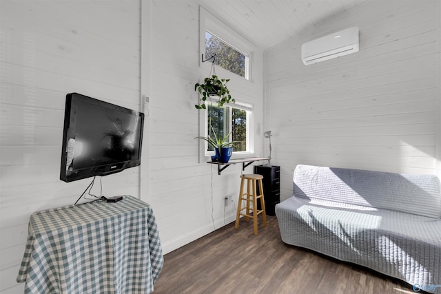 bedroom with a wall mounted air conditioner, dark hardwood / wood-style floors, vaulted ceiling, and wooden walls