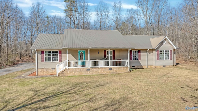 view of front of home featuring a porch, metal roof, a front yard, and crawl space