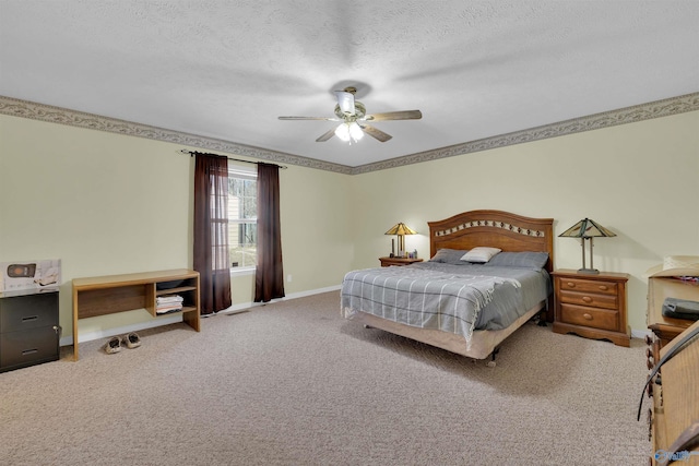 carpeted bedroom with ceiling fan, a textured ceiling, and baseboards