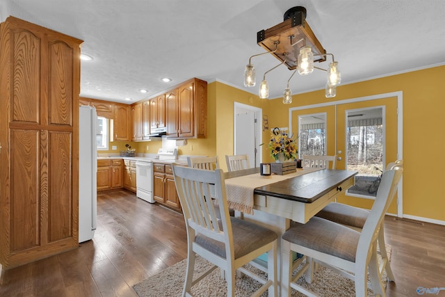 dining room with dark wood-style floors, recessed lighting, french doors, and ornamental molding