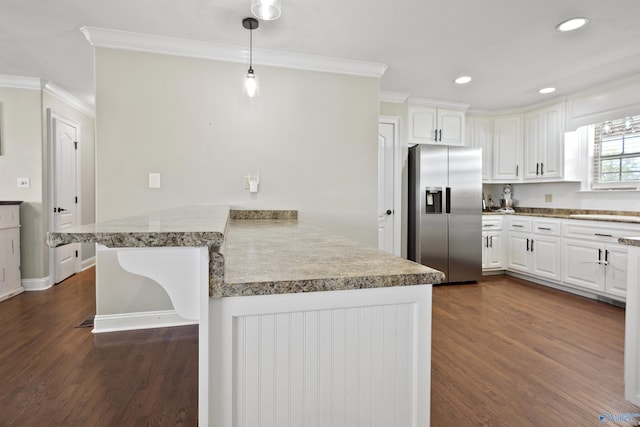 kitchen featuring white cabinets, stainless steel fridge with ice dispenser, crown molding, a peninsula, and dark wood-style flooring
